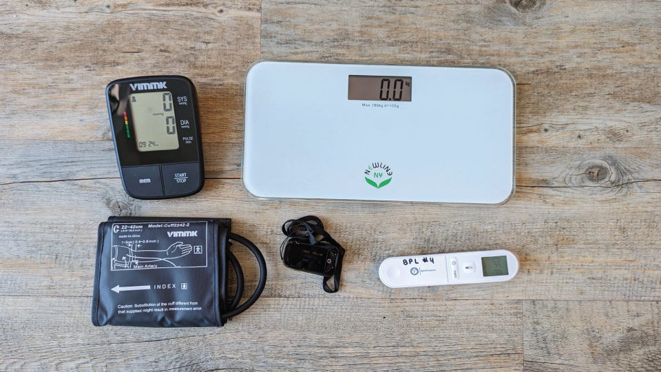 Wellness Kit with blood pressure cuff, oximeter, infrared thermometer, and scale